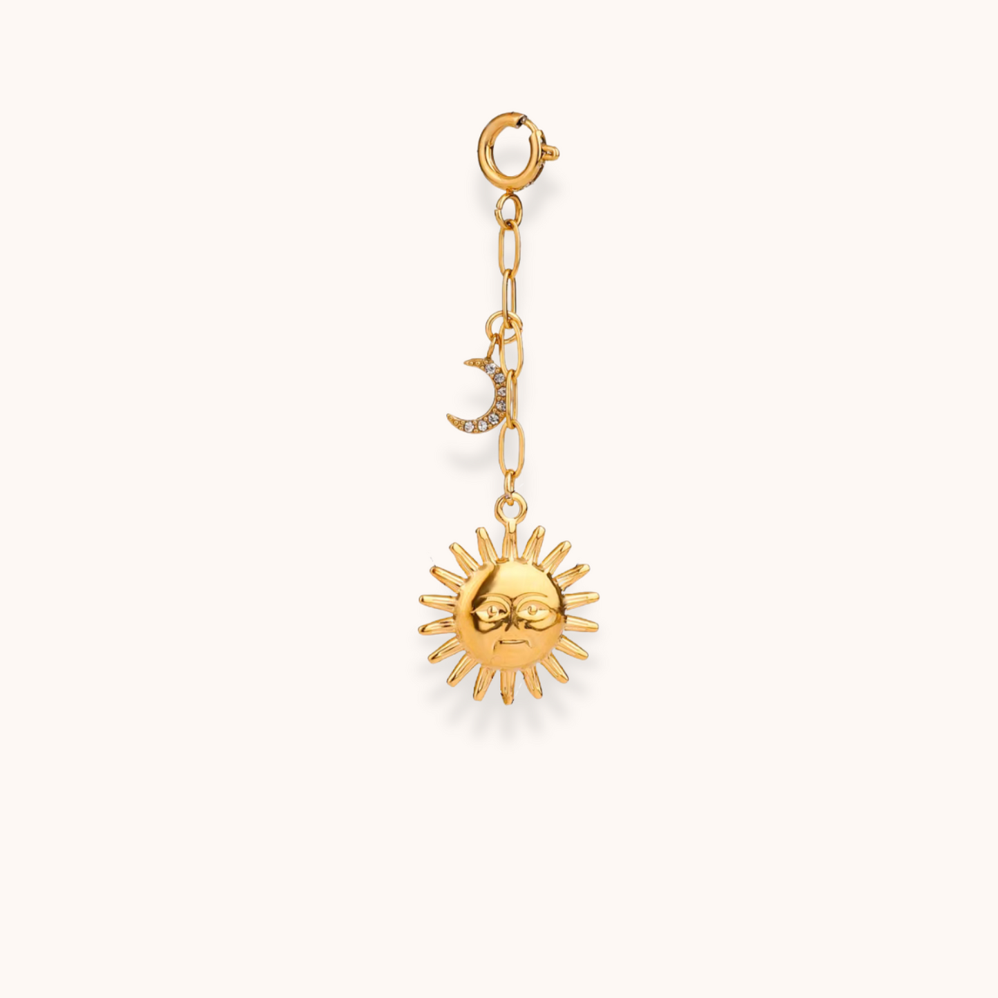Gold sun and moon charm from Aurelia Glamour’s Golden Charm Collection, shown on gold-plated chain with clasp