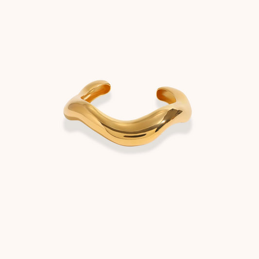 Curved gold waterproof cuff bracelet with polished sculptural design – Sol Wave Cuff by Aurelia Glamour