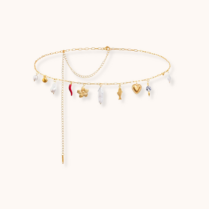 Gold waist chain with multiple charms including heart, pearl, star, and chili pepper on an adjustable stainless steel chain.