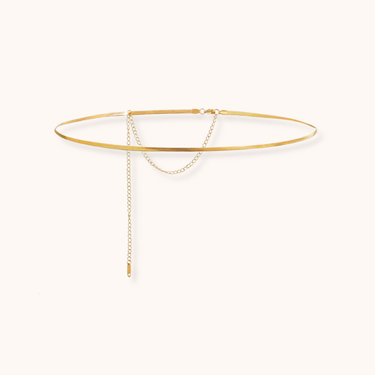 Minimalist gold-tone waist chain with fine drop chain detailing and adjustable clasp, displayed on a white background with dimensions.