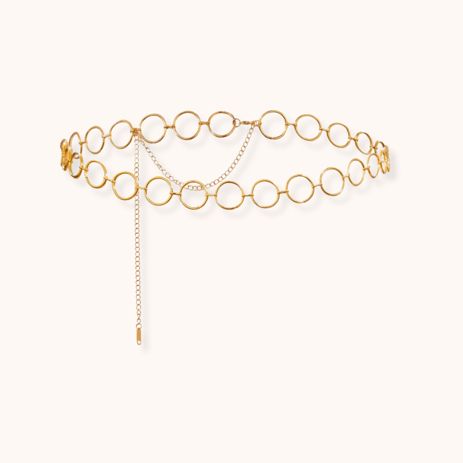 Gold circular link waist chain with drop chain detailing and adjustable clasp, made of waterproof stainless steel.