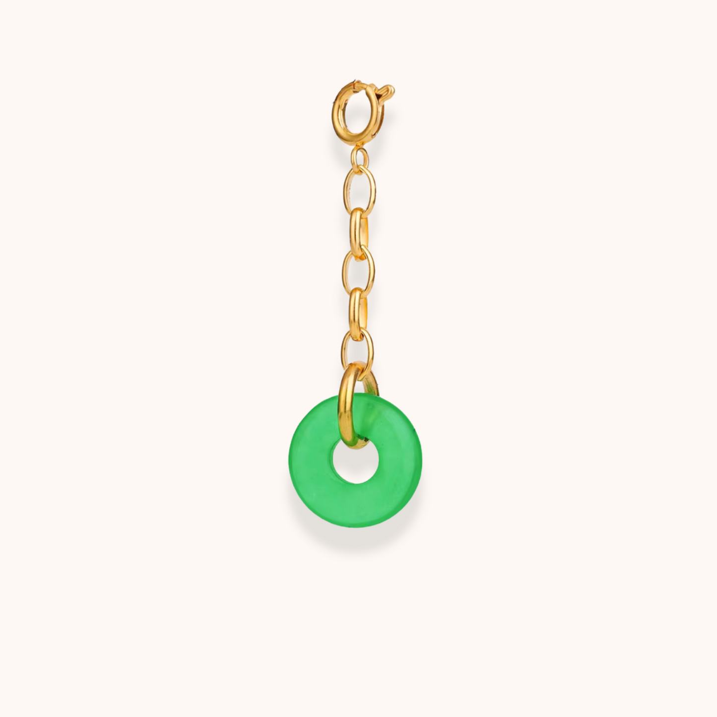 Gold clip-on charm with green circular pendant – part of Aurelia Glamour’s Golden Charm Collection