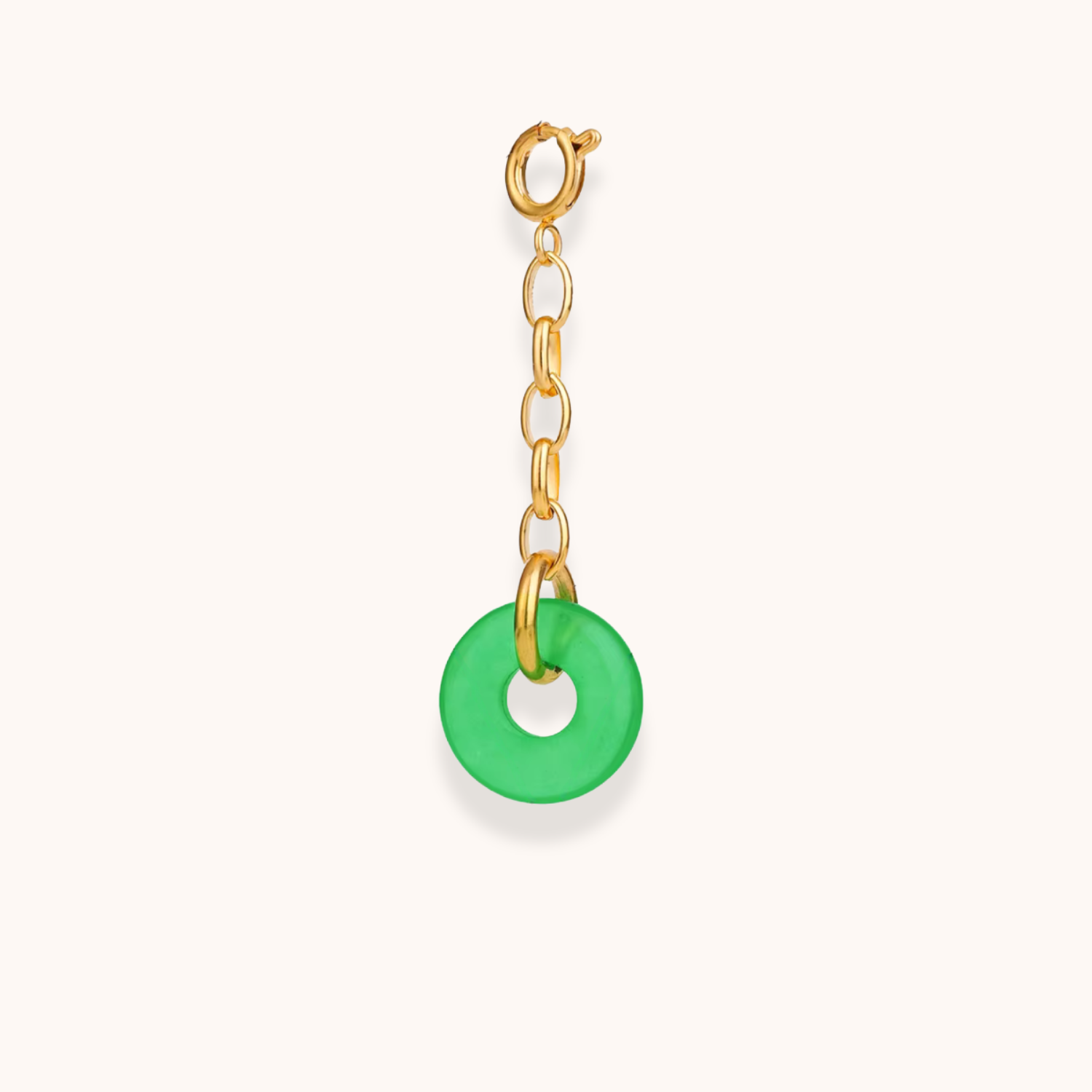 Gold clip-on charm with green circular pendant – part of Aurelia Glamour’s Golden Charm Collection