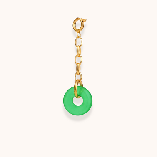 Gold clip-on charm with green circular pendant – part of Aurelia Glamour’s Golden Charm Collection