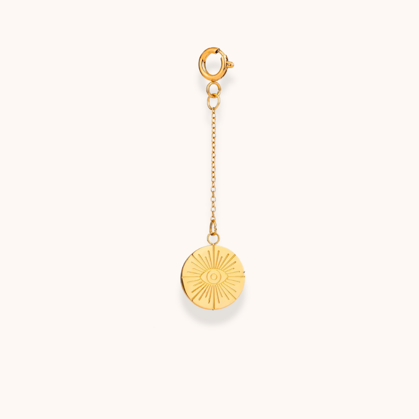 Gold sunburst medallion charm with engraved eye detail, clip-on design from Aurelia Glamour Golden Charm Collection