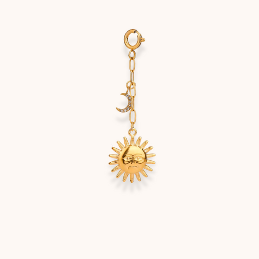 Gold sun and moon charm from Aurelia Glamour’s Golden Charm Collection, shown on gold-plated chain with clasp