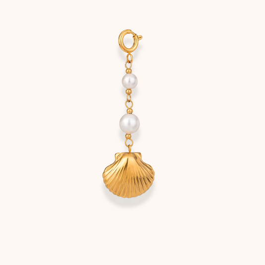 Golden shell and pearl charm from Aurelia Glamour’s Golden Charm Collection, shown with stainless steel gold-plated chain