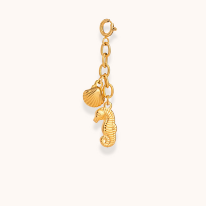 Gold seahorse and shell charm from Aurelia Glamour’s Golden Charm Collection on waterproof stainless steel chain