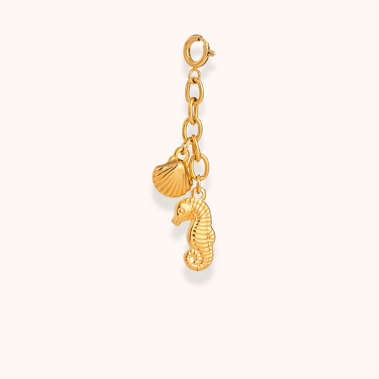 Gold seahorse and shell charm from Aurelia Glamour’s Golden Charm Collection on waterproof stainless steel chain