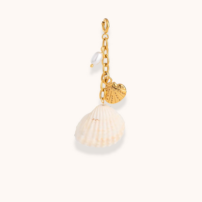Golden shell charm with coin and pearl on chain from Aurelia Glamour's Golden Charm Collection