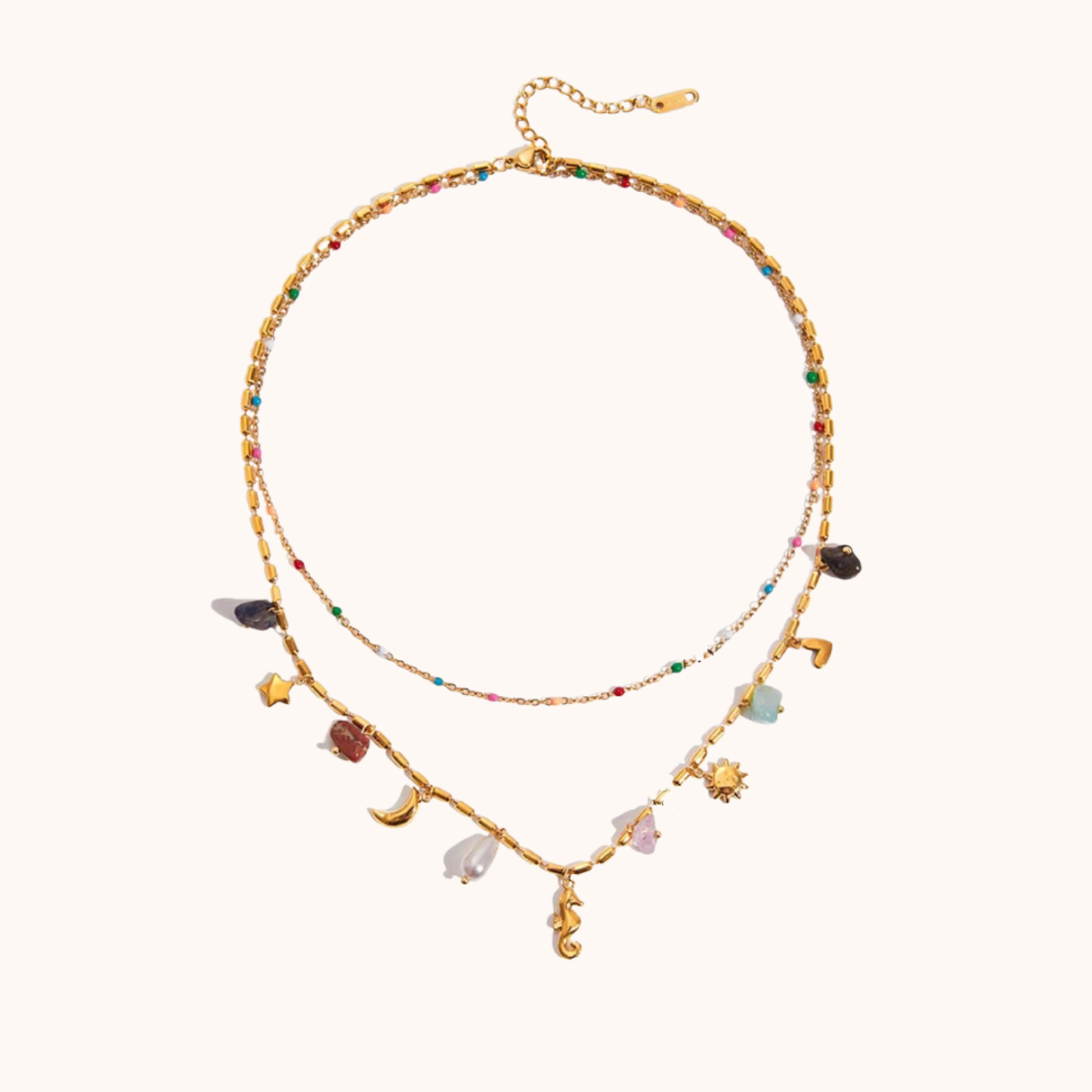 Gold necklace with colorful charms on a white background